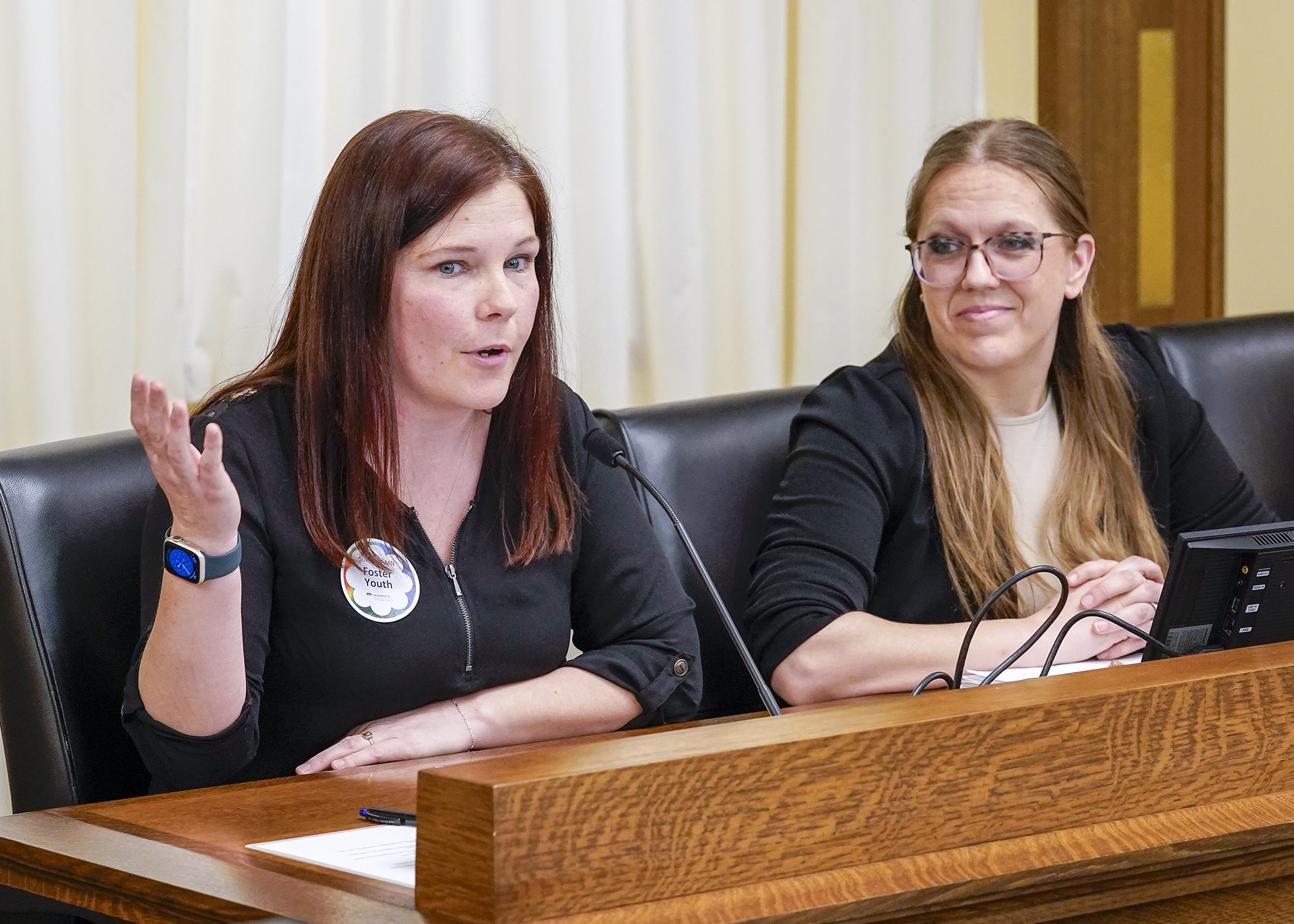 Ombudsperson for Foster Youth Misty Coonce testifies March 11 before the House children and families committee in support of a bill sponsored by Rep. Jessica Hanson, right, to establish a Foster Youth Bill of Rights. (Photo by Andrew VonBank)